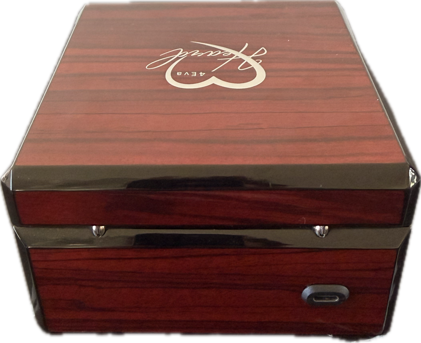 Front view of the closed rosewood box showing its compact form and USB charging port